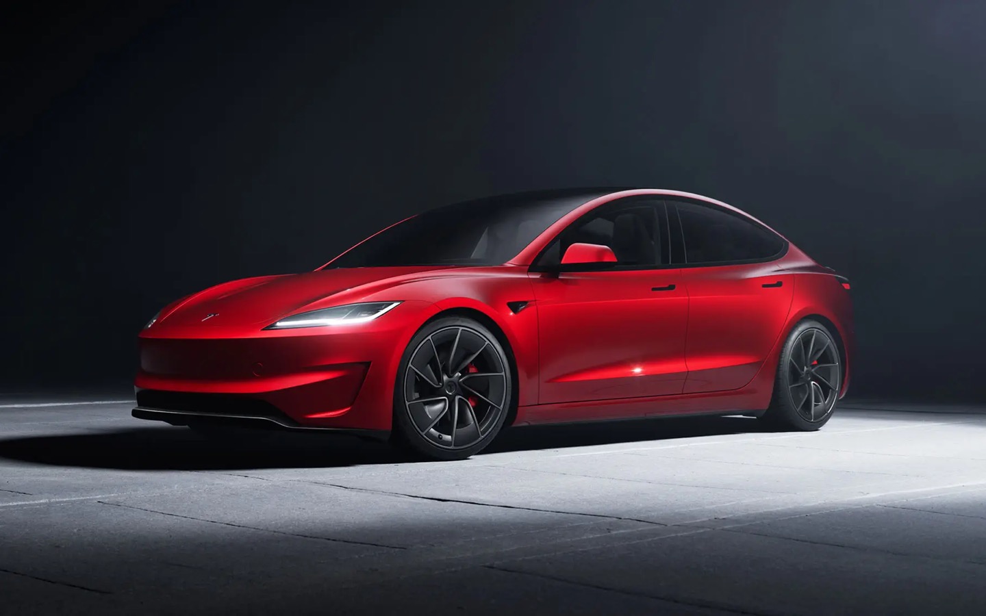 Tesla Model 3 Performance — red, studio shot