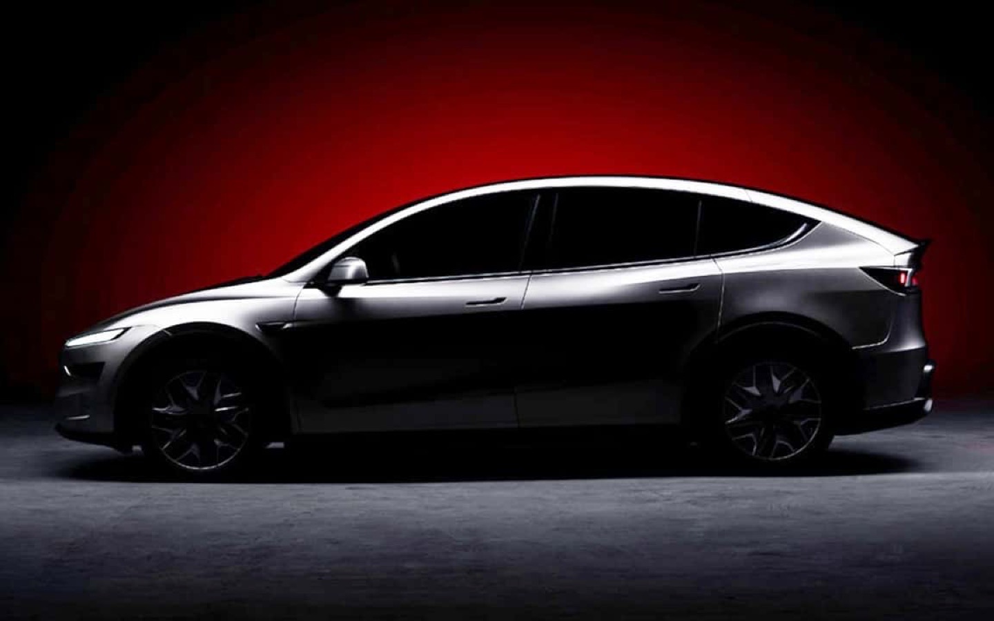 Tesla Model Y — studio shot, side profile